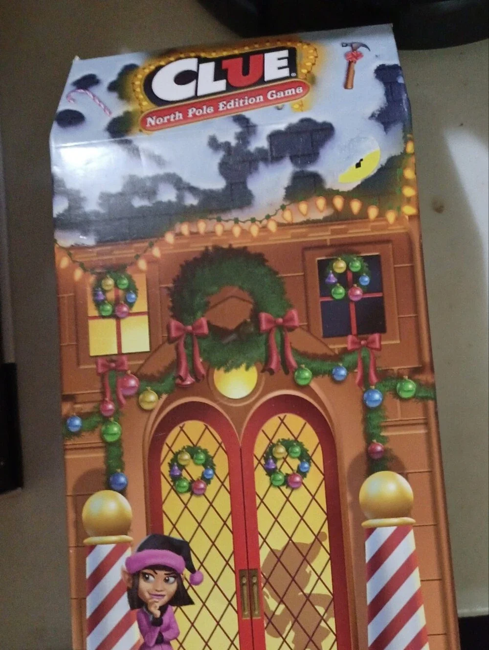 Hasbro Clue North Pole Edition Game - red, green, gold, pink, blue
